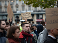 A demonstrator holds a sign reading ''Stop car violence'' during a gathering at the Place de La Republique in Paris, France, on October 19,...