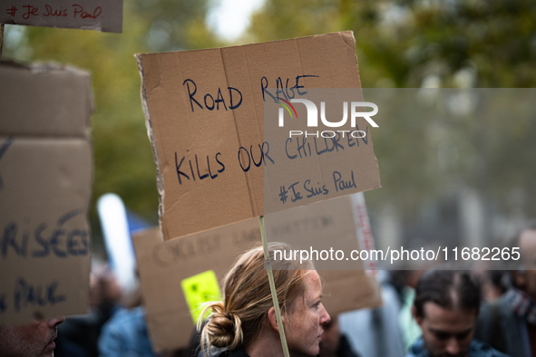 A woman holds a sign reading ''road rage kills our children'' during a gathering at the Place de La Republique in Paris, France, on October...