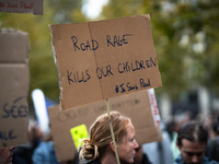 A woman holds a sign reading ''road rage kills our children'' during a gathering at the Place de La Republique in Paris, France, on October...