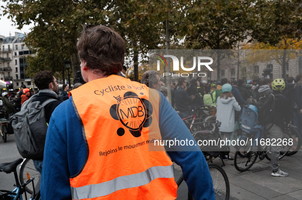 A man wears a shirt of the movement MDB during a gathering at the Place de La Republique in Paris, France, on October 19, 2024, to pay tribu...