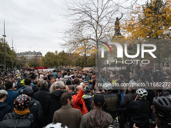 People gather at the Place de La Republique in Paris, France, on October 19, 2024, to pay tribute to Paul, a 27-year-old cyclist who dies af...