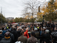 People gather at the Place de La Republique in Paris, France, on October 19, 2024, to pay tribute to Paul, a 27-year-old cyclist who dies af...