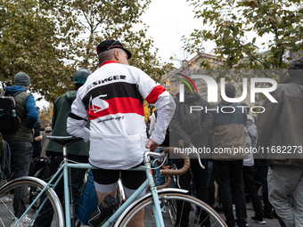 People gather at the Place de La Republique in Paris, France, on October 19, 2024, to pay tribute to Paul, a 27-year-old cyclist who dies af...