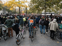 People gather at the Place de La Republique in Paris, France, on October 19, 2024, to pay tribute to Paul, a 27-year-old cyclist who dies af...