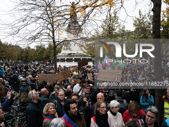 People gather at the Place de La Republique in Paris, France, on October 19, 2024, to pay tribute to Paul, a 27-year-old cyclist who dies af...