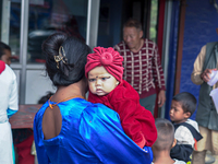 A health worker gives a Vitamin A capsule to a child in Dhading, Nepal, on October 19, 2024. (