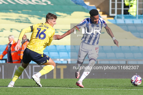 #11, Grady Diangana of WBA holds off #16, Ben Nelson of Oxford during the Sky Bet Championship match between Oxford United and West Bromwich...