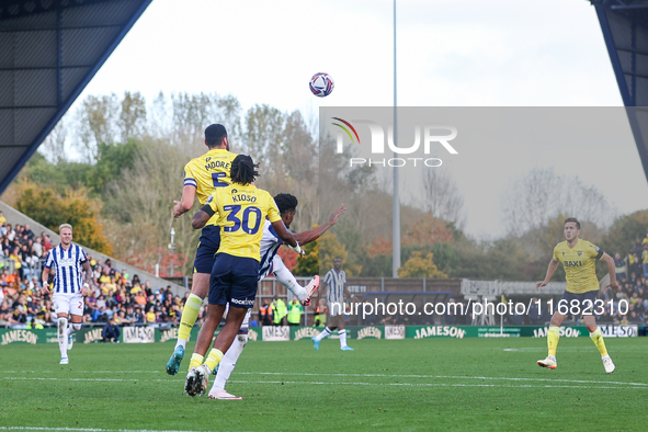 Elliott Moore of Oxford and Grady Diangana of WBA battle in the air during the Sky Bet Championship match between Oxford United and West Bro...