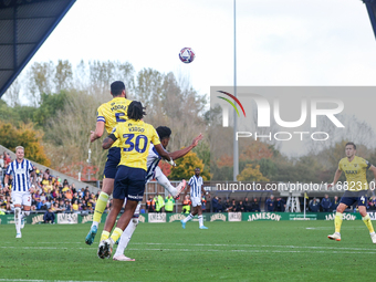 Elliott Moore of Oxford and Grady Diangana of WBA battle in the air during the Sky Bet Championship match between Oxford United and West Bro...