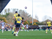 Elliott Moore of Oxford and Grady Diangana of WBA battle in the air during the Sky Bet Championship match between Oxford United and West Bro...