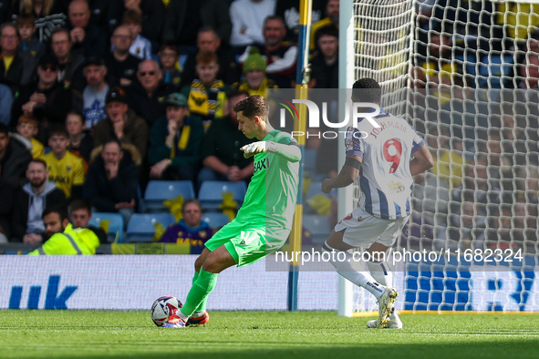 Jamie Cunningham of Oxford clears the ball under pressure from Josh Maja of WBA during the Sky Bet Championship match between Oxford United...