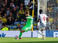 Jamie Cunningham of Oxford clears the ball under pressure from Josh Maja of WBA during the Sky Bet Championship match between Oxford United...