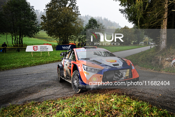 Driver Thierry Neuville and co-driver Martijn Wydaeghe of the Hyundai Shell Mobis World Rally Team, in a Hyundai I20 N Rally1 Hybrid, face t...