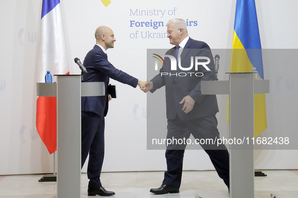 In Kyiv, Ukraine, on October 19, 2024, the Minister of Foreign Affairs of Ukraine, Andrii Sybiha, shakes hands with the Minister for Europe...