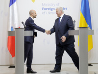 In Kyiv, Ukraine, on October 19, 2024, the Minister of Foreign Affairs of Ukraine, Andrii Sybiha, shakes hands with the Minister for Europe...