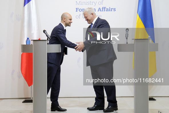 In Kyiv, Ukraine, on October 19, 2024, the Minister of Foreign Affairs of Ukraine, Andrii Sybiha, shakes hands with the Minister for Europe...