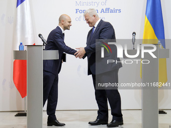 In Kyiv, Ukraine, on October 19, 2024, the Minister of Foreign Affairs of Ukraine, Andrii Sybiha, shakes hands with the Minister for Europe...