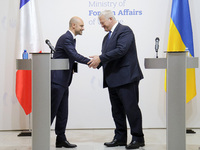 In Kyiv, Ukraine, on October 19, 2024, the Minister of Foreign Affairs of Ukraine, Andrii Sybiha, shakes hands with the Minister for Europe...