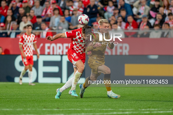 Orri Oskarsson of Real Sociedad and Ladislav Krejci of Girona FC are in action during the LaLiga EA Sports 2024-2025 match between Girona FC...