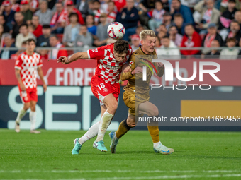 Orri Oskarsson of Real Sociedad and Ladislav Krejci of Girona FC are in action during the LaLiga EA Sports 2024-2025 match between Girona FC...