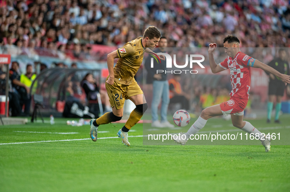 Luka Sucic of Real Sociedad and Arnau Martinez of Girona FC compete for the ball during the LaLiga Hypermotion 2024 - 2025 match between Gir...