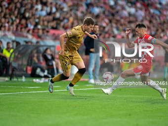 Luka Sucic of Real Sociedad and Arnau Martinez of Girona FC compete for the ball during the LaLiga Hypermotion 2024 - 2025 match between Gir...