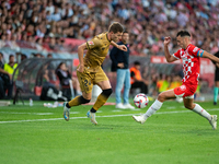 Luka Sucic of Real Sociedad and Arnau Martinez of Girona FC compete for the ball during the LaLiga Hypermotion 2024 - 2025 match between Gir...