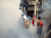 A worker sprays pesticide to kill mosquitoes in the capital city in Dhaka, Bangladesh, on October 19, 2024. The statement adds that this yea...