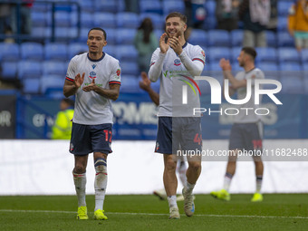 Josh Dacres-Cogley #12 of Bolton Wanderers F.C. applauds at full time during the Sky Bet League 1 match between Bolton Wanderers and Burton...