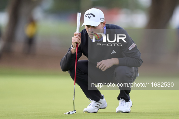 In San Roque, Spain, on October 19, 2024, Nicolai Hojgaard of Denmark studies his shot on the 1st green on the third day of the Estrella Dam...