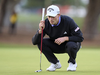 In San Roque, Spain, on October 19, 2024, Nicolai Hojgaard of Denmark studies his shot on the 1st green on the third day of the Estrella Dam...