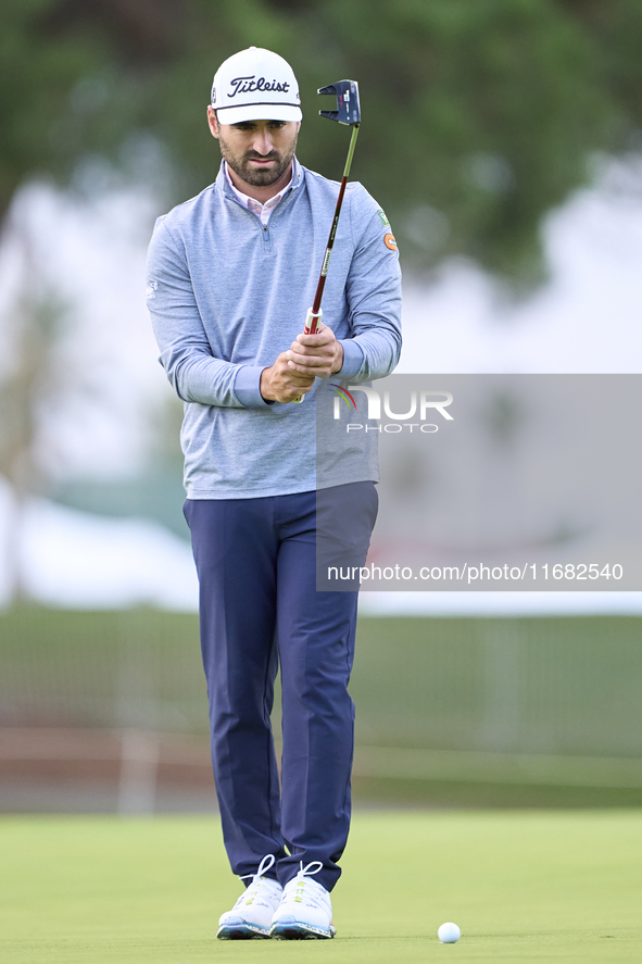 In San Roque, Spain, on October 19, 2024, Antoine Rozner of France studies his shot on the 1st green on the third day of the Estrella Damm N...