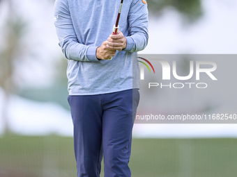 In San Roque, Spain, on October 19, 2024, Antoine Rozner of France studies his shot on the 1st green on the third day of the Estrella Damm N...