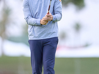 In San Roque, Spain, on October 19, 2024, Antoine Rozner of France studies his shot on the 1st green on the third day of the Estrella Damm N...