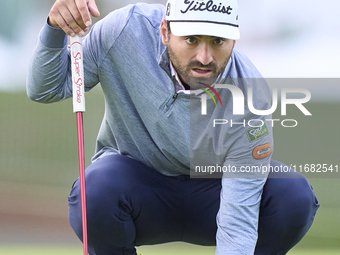 In San Roque, Spain, on October 19, 2024, Antoine Rozner of France studies his shot on the 1st green on the third day of the Estrella Damm N...