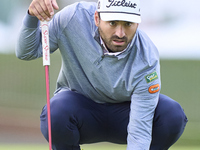 In San Roque, Spain, on October 19, 2024, Antoine Rozner of France studies his shot on the 1st green on the third day of the Estrella Damm N...