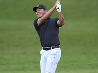 Ashun Wu of China plays his second shot on the 1st hole on the third day of the Estrella Damm N.A. Andalucia Masters 2024 at Real Club de Go...