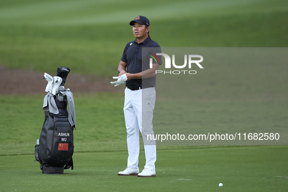 Ashun Wu of China reacts on the 1st hole on the third day of the Estrella Damm N.A. Andalucia Masters 2024 at Real Club de Golf Sotogrande i...