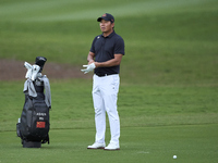 Ashun Wu of China reacts on the 1st hole on the third day of the Estrella Damm N.A. Andalucia Masters 2024 at Real Club de Golf Sotogrande i...