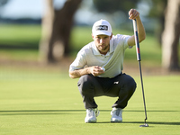 Rasmus Neergaard-Petersen of Denmark studies his shot on the 1st green on the third day of the Estrella Damm N.A. Andalucia Masters 2024 at...