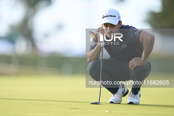 In San Roque, Spain, on October 19, 2024, Tom Vaillant of France studies his shot on the 1st green on the third day of the Estrella Damm N.A...