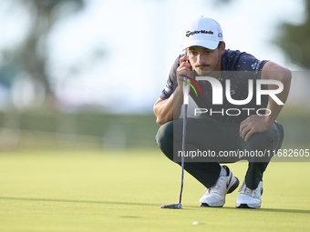 In San Roque, Spain, on October 19, 2024, Tom Vaillant of France studies his shot on the 1st green on the third day of the Estrella Damm N.A...