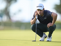 In San Roque, Spain, on October 19, 2024, Tom Vaillant of France studies his shot on the 1st green on the third day of the Estrella Damm N.A...