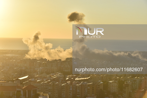 Black smoke billows from Beirut's southern suburb following heavy Israeli air raids on the pro-Iranian Hezbollah stronghold in Beirut, Leban...