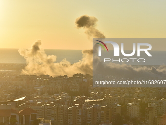 Black smoke billows from Beirut's southern suburb following heavy Israeli air raids on the pro-Iranian Hezbollah stronghold in Beirut, Leban...