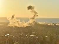 Black smoke billows from Beirut's southern suburb following heavy Israeli air raids on the pro-Iranian Hezbollah stronghold in Beirut, Leban...