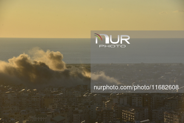 Black smoke billows from Beirut's southern suburb following heavy Israeli air raids on the pro-Iranian Hezbollah stronghold in Beirut, Leban...