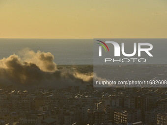 Black smoke billows from Beirut's southern suburb following heavy Israeli air raids on the pro-Iranian Hezbollah stronghold in Beirut, Leban...