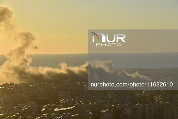 Black smoke billows from Beirut's southern suburb following heavy Israeli air raids on the pro-Iranian Hezbollah stronghold in Beirut, Leban...