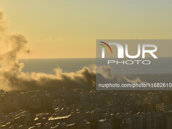 Black smoke billows from Beirut's southern suburb following heavy Israeli air raids on the pro-Iranian Hezbollah stronghold in Beirut, Leban...